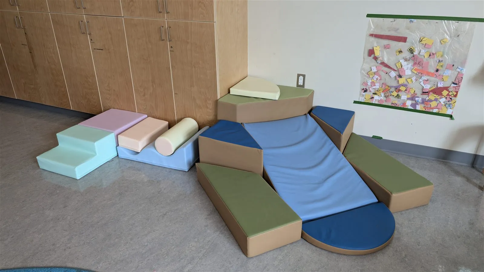 A sensory "play river" activity area in the Caterpillar Room
